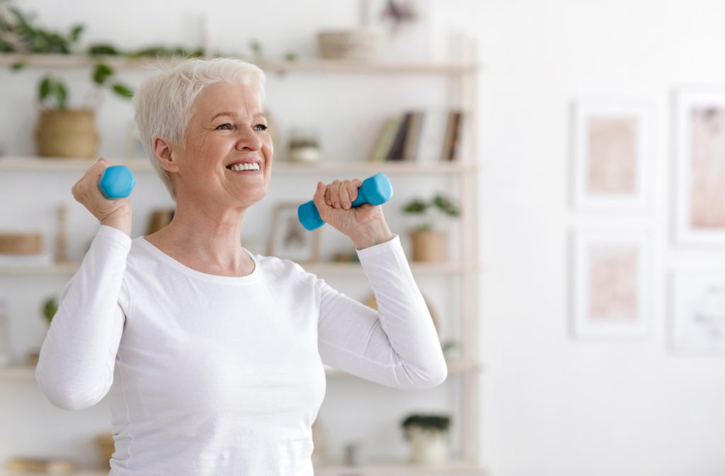 Senior women exercising at senior community with dumbbells